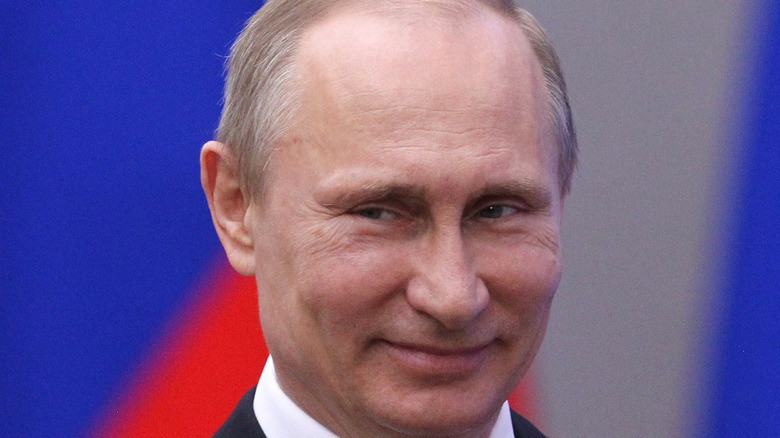 Vladimir Putin smiles impishly