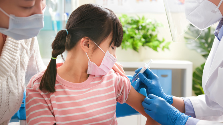 child getting vaccine