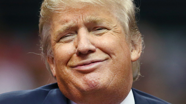Donald Trump shrugs at an event