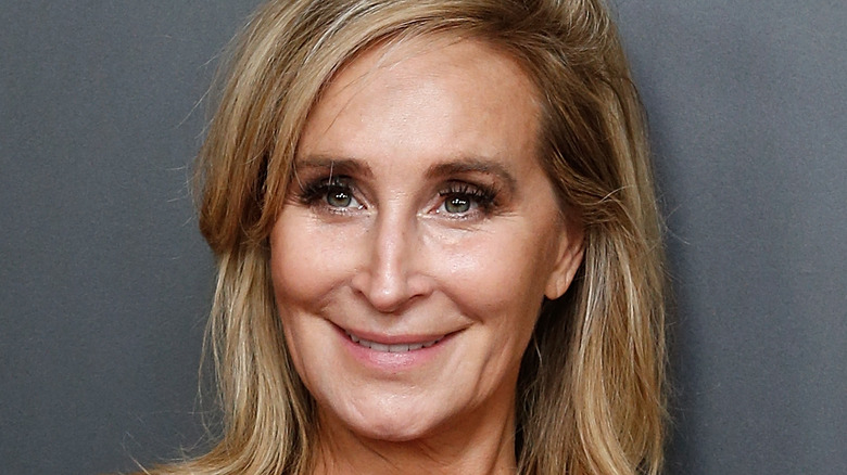 Sonja Morgan smiles with her hair down.