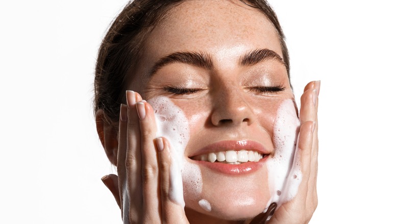 Woman washing face