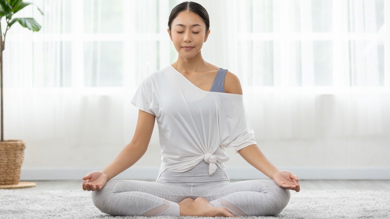 Woman doing yoga at home