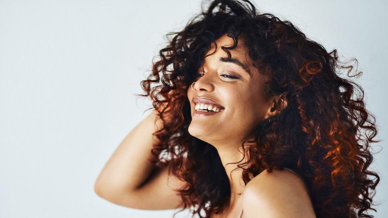 Woman with voluminous, curly hair