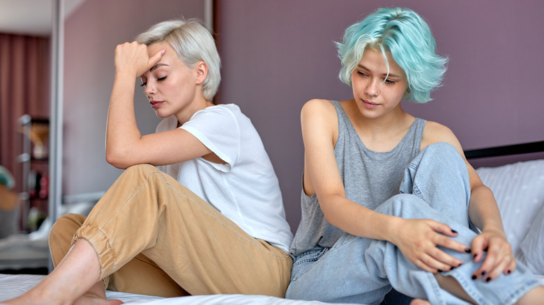 Lesbian couple displaying awkward tension