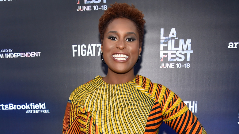 Issa Rae smiling at a screening of Love and Basketball