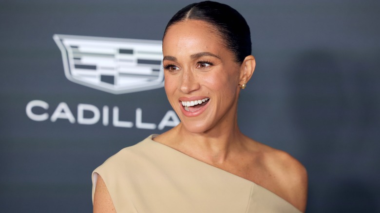 Meghan Markle smiling on the red carpet