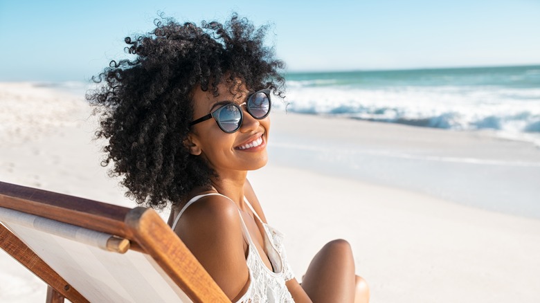 Woman posing on beach