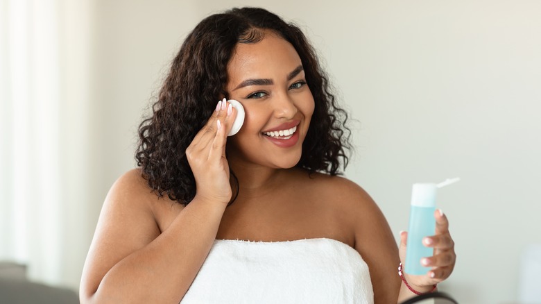 A woman using a toner