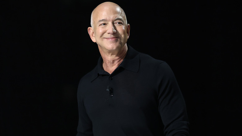 Jeff Bezos smiling in a black shirt