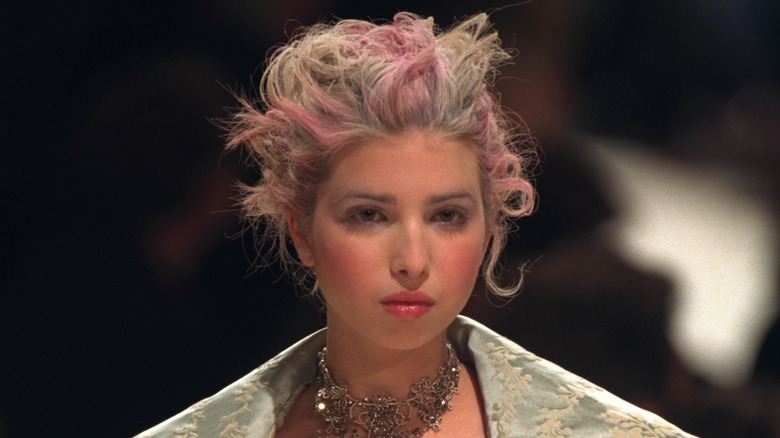 Ivanka Trump on a runway with pink and gray hair