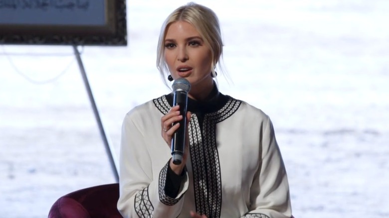 Ivanka Trump sitting on stage holding mic in Morocco