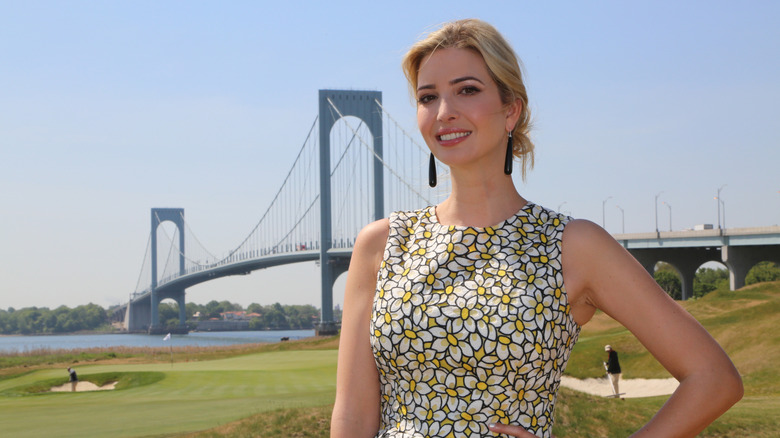 Ivanka Trump poses in front of a bridge