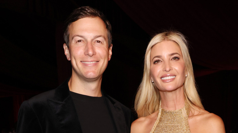 Jared Kushner and Ivanka Trump smiling while posing at an event together