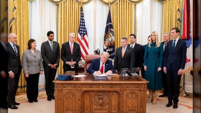 Donald Trump signing bill in Oval Office