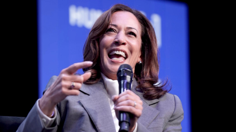 Kamala Harris speaking into a microphone