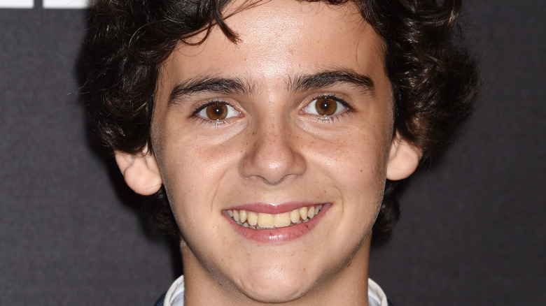 Jack Dylan Grazer smiles on the red carpet