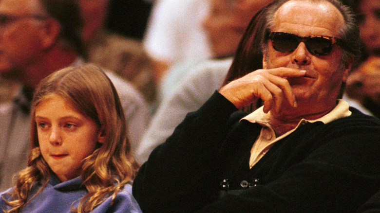 Jack Nicholson's daughter with her father at a game