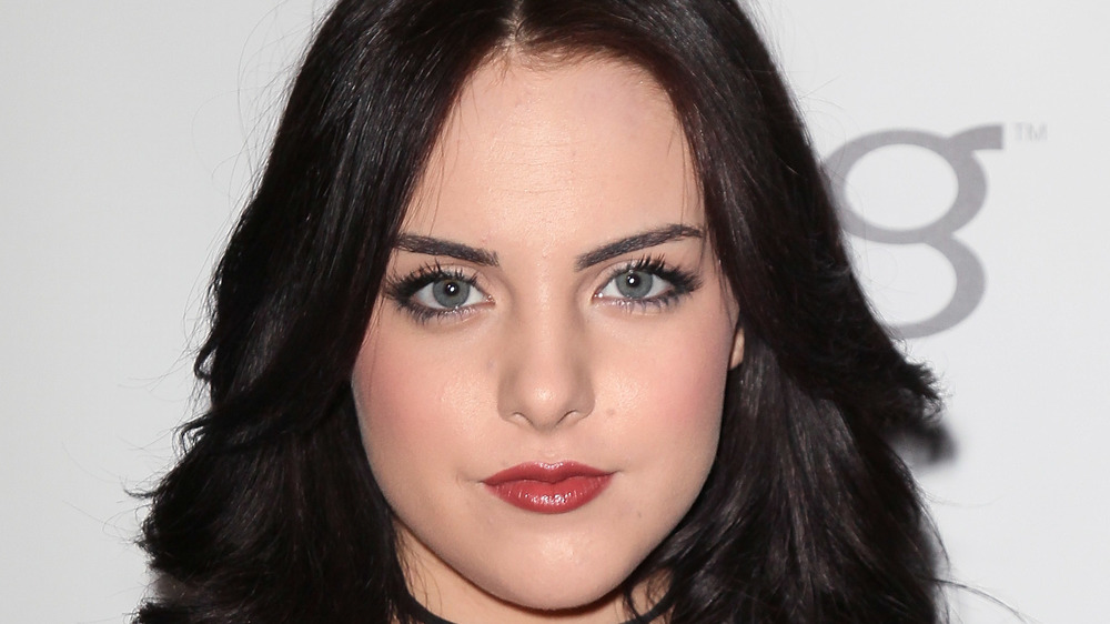 Elizabeth Gillies posing at event