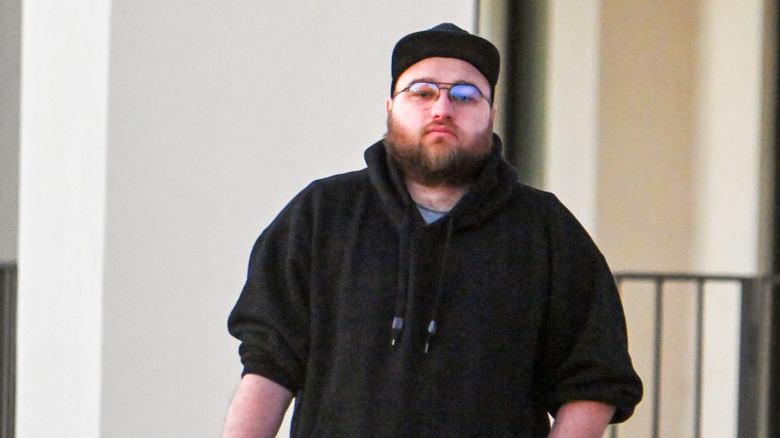 Angus T Jones is seen out for a walk on December 5, 2023 in Los Angeles, California.