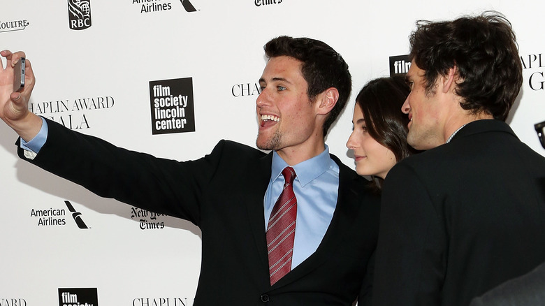 Jake, Romy, and Nick Reiner taking a selfie on the red carpet