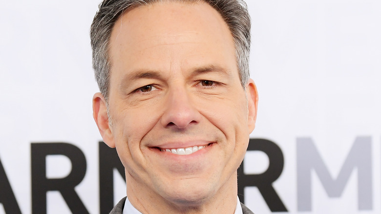 Jake Tapper smiling on the red carpet