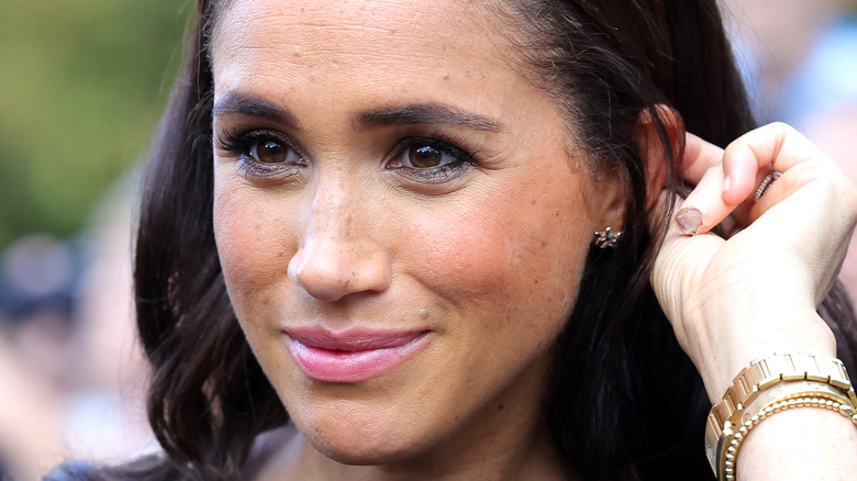 Meghan Markle speaking with members of the public when paying tribute to Queen Elizabeth in 2022