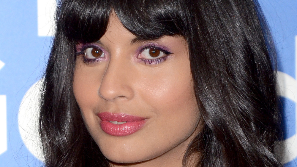 Jameela Jamil smiles with bangs