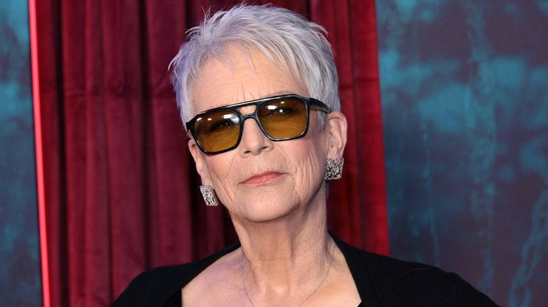 Jamie Lee Curtis wearing sunglasses at a red carpet event