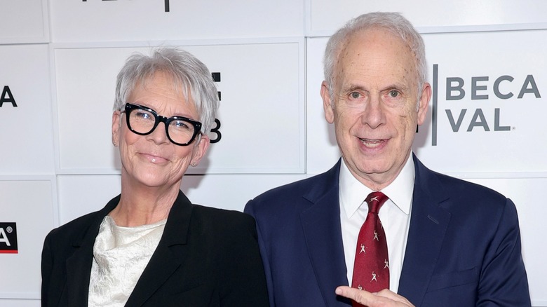 Jamie Lee Curtis and Christopher Guest pose for a picture.