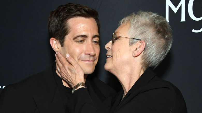 Jamie Lee Curtis about to kiss Jake Gyllenhaal's cheek on the red carpet
