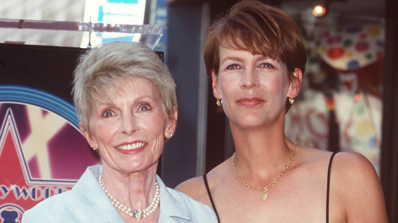 Janet Leigh and Jamie Lee Curtis smiling while posing together at an event