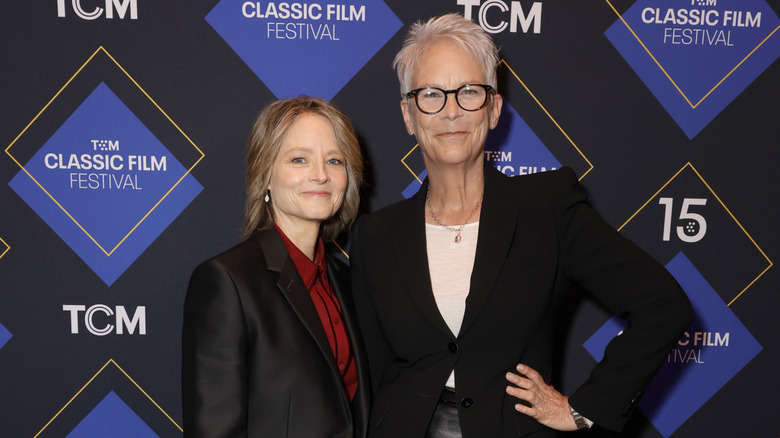 Jamie Lee Curtis and Jodie Foster smiling together at the TCM Classic Film Festival