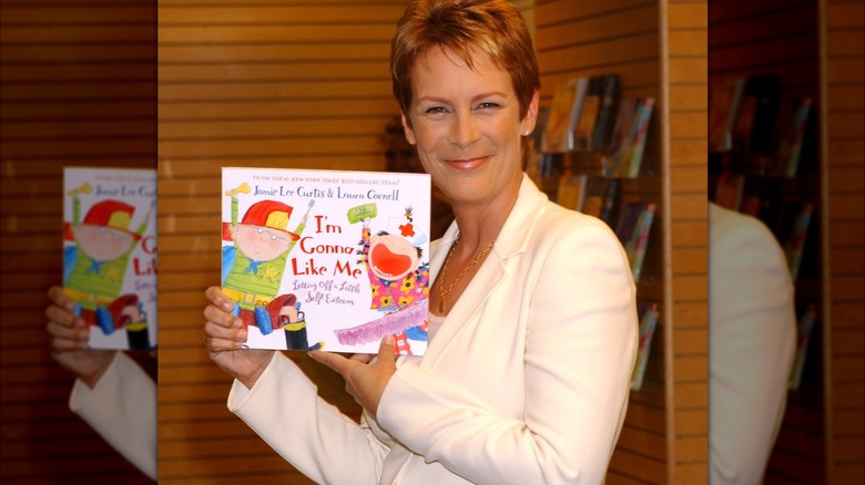 Jamie Lee Curtis holding her book "I'm Gonna Like Me" at Barnes & Noble in 2002