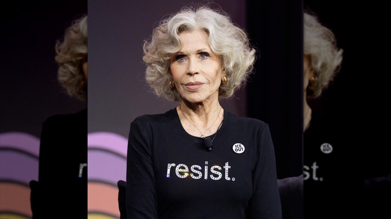 Jane Fonda sitting on stage
