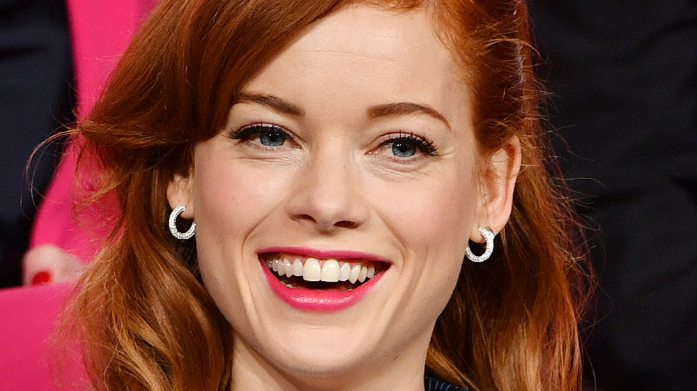 Jane Levy smiling with delicate earrings