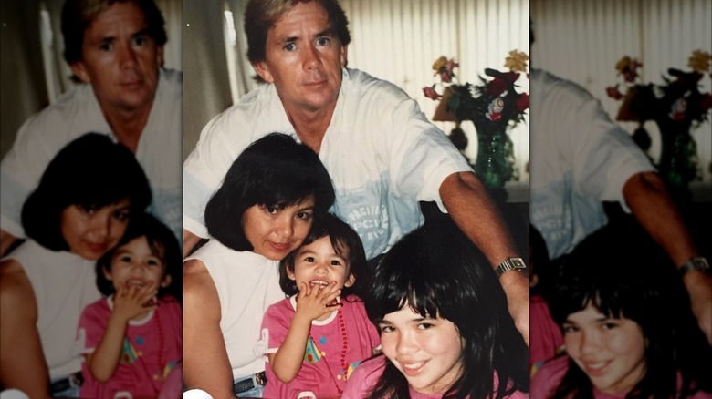 Janel Parrish as a child with her parents and sister