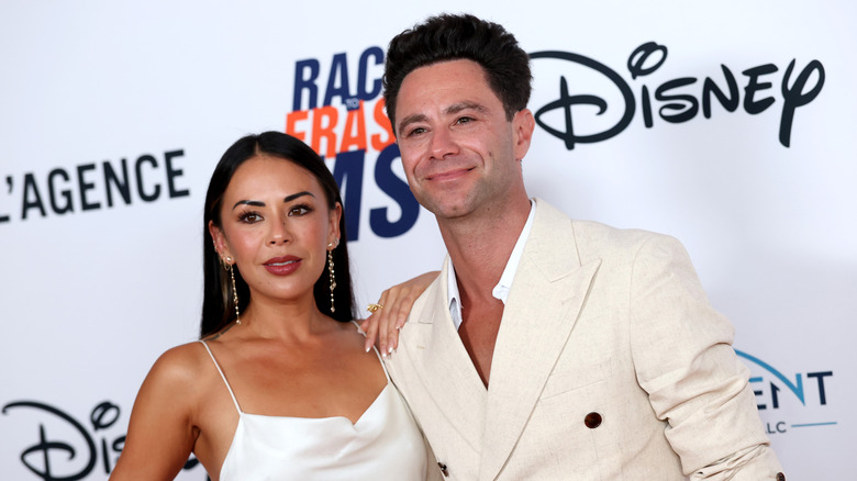 Janel Parrish and Sasha Farber posing together at the 33rd Annual Race To Erase MS Gala at Fairmont Century Plaza.