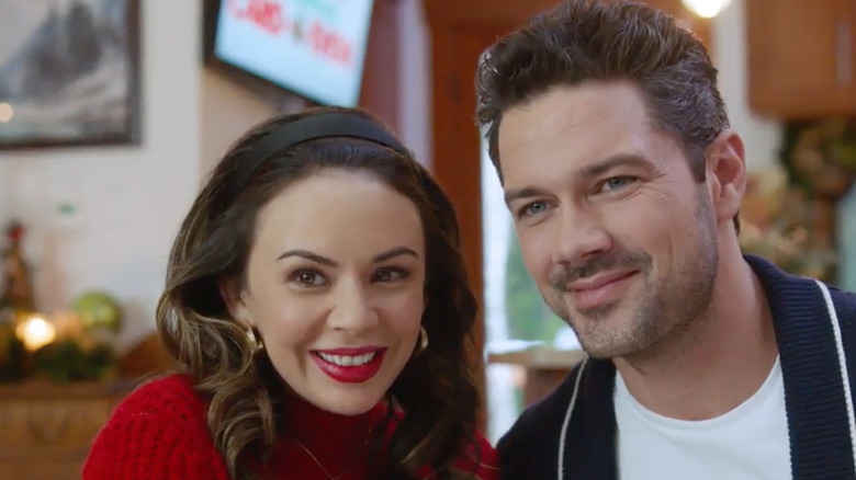 Janel Parrish and  Ryan Paevey in the Hallmark movie "Coyote Creek Christmas"