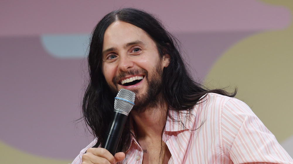 Jared Leto sitting on couch