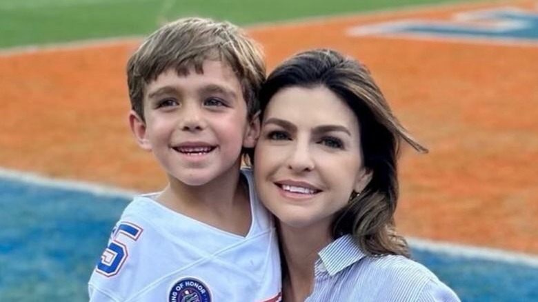 Casey DeSantis poses with her son Mason DeSantis on a football field in Washington, DC (2024)