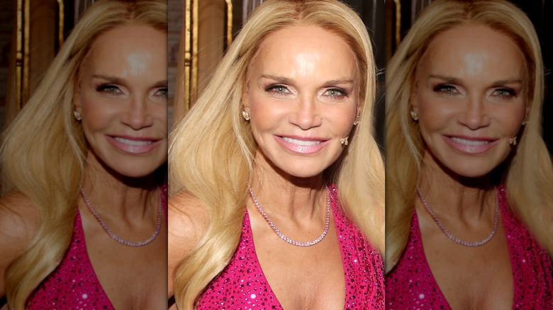 Kristin Chenoweth smiling in a sparkly pink dress
