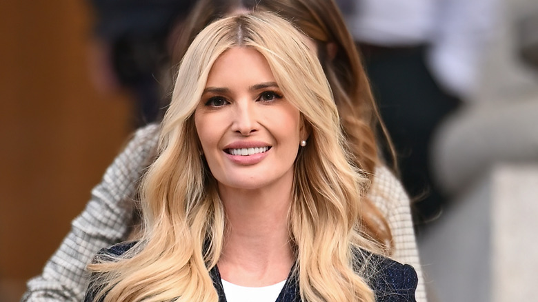 Ivanka Trump smiling in a black jacket and white t-shirt after leaving the Supreme Court.