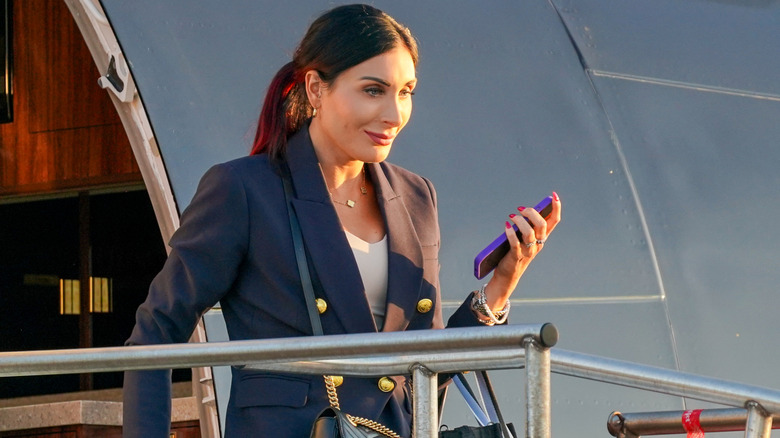 Laura Loomer exiting an airplane