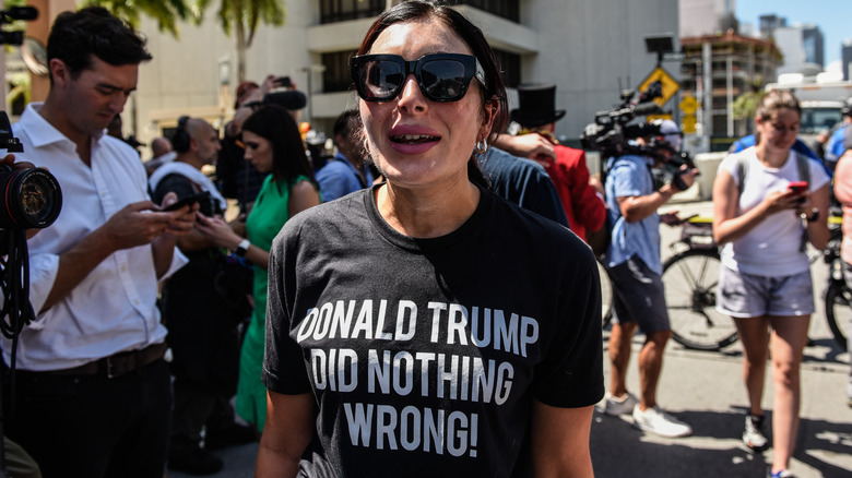 Laura Loomer wearing sunglasses during a protest