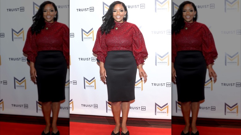 Jasmine Crockett on a red carpet