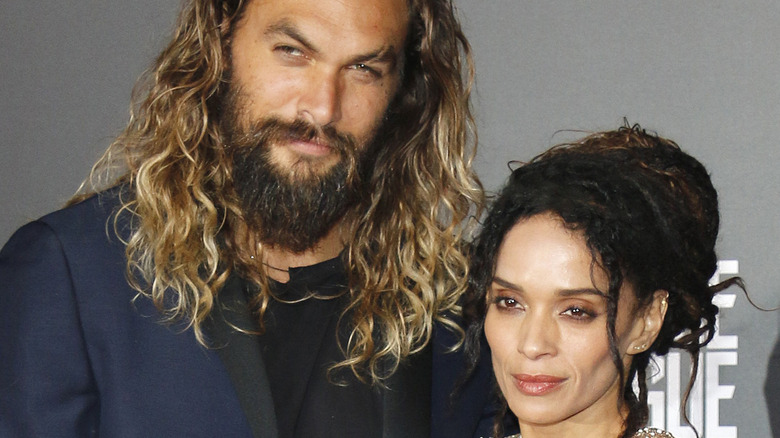 Jason Momoa and Lisa Bonet pose on the red carpet.