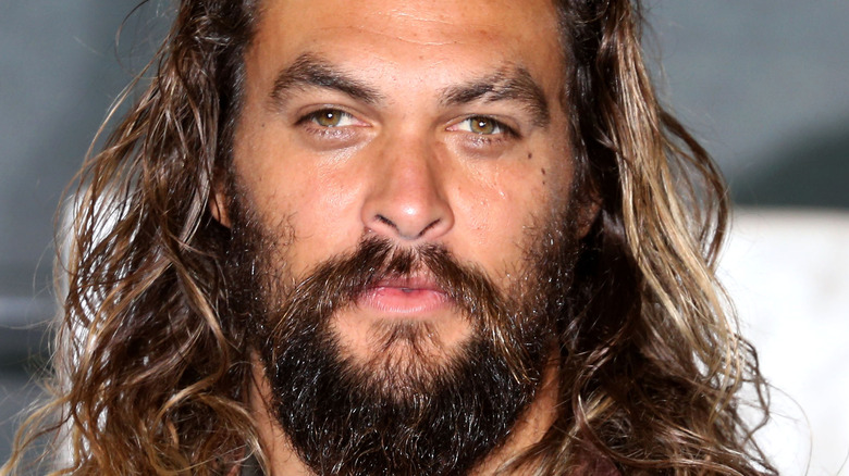 Jason Momoa poses on the red carpet