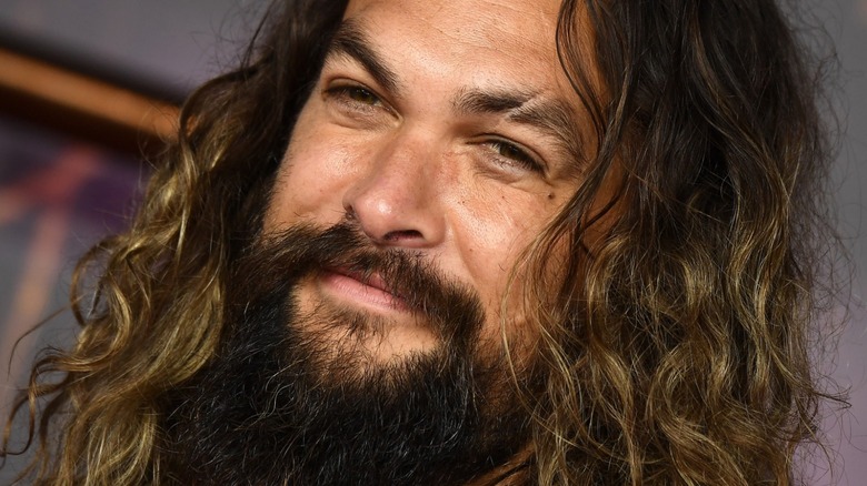 Jason Momoa posing on the red carpet