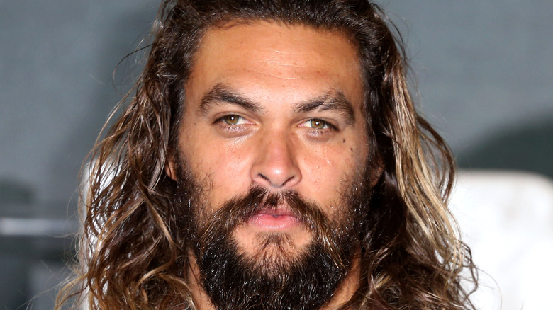 Jason Momoa poses on the red carpet