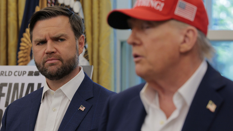 JD Vance looking sideways at Donald Trump